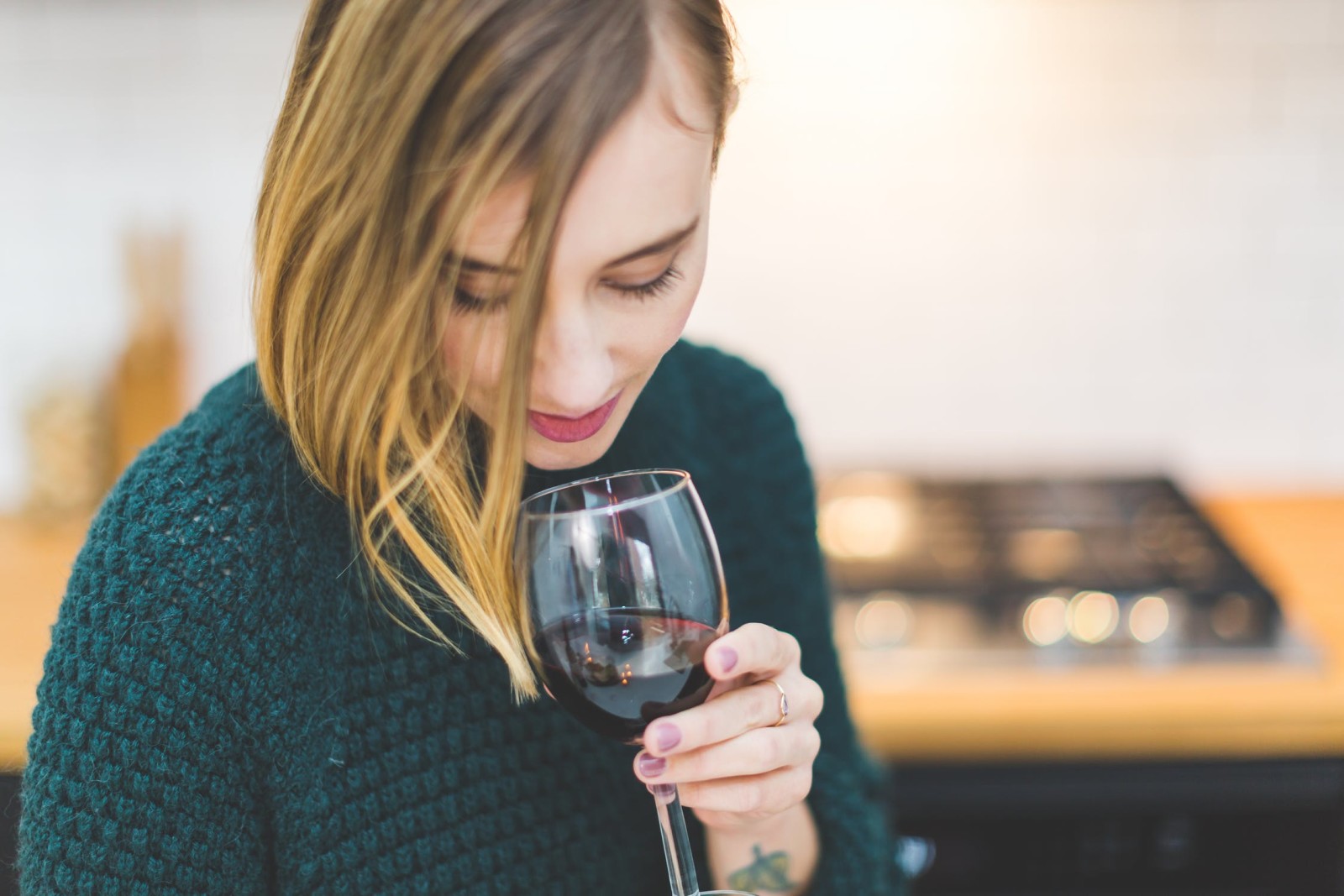 Woman tasting wine