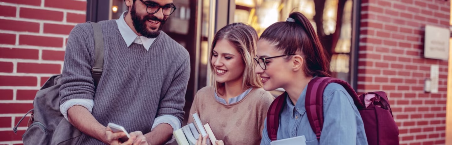 A male student and two female students discuss about the IELTS test.