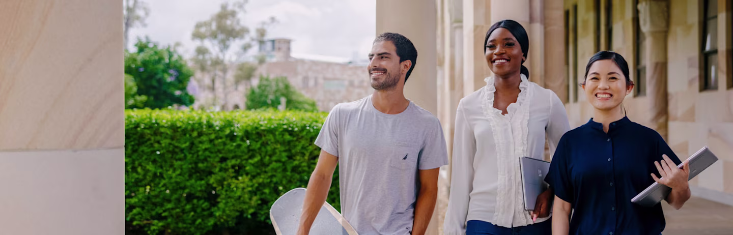 Three IELTS test takers approaching their test location on the test day.