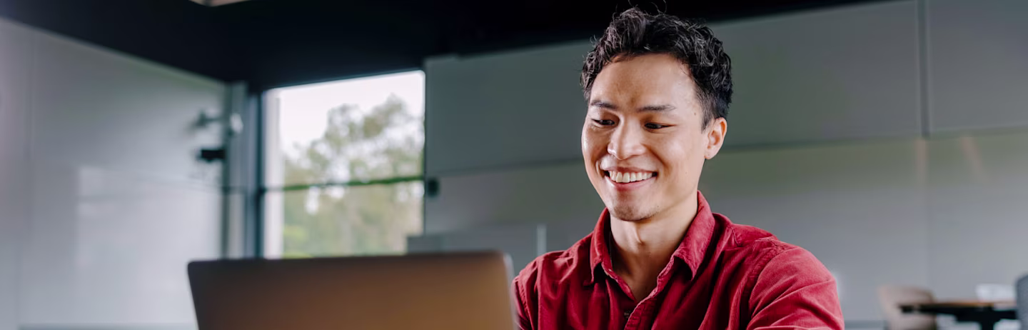 An IELTS test taker with a laptop