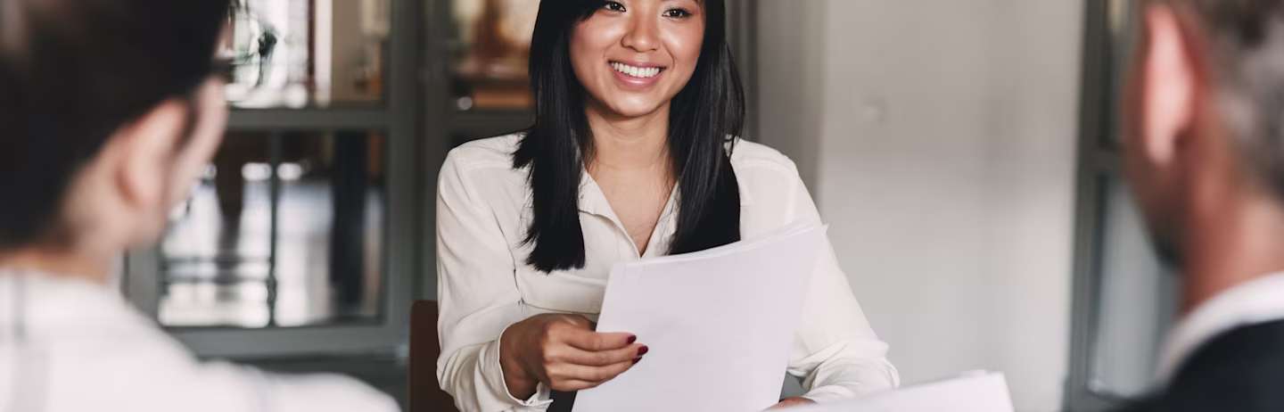 Female candidate in professional attire attending an interview