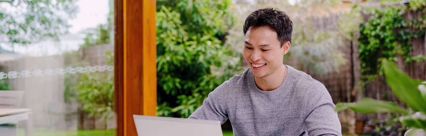 A test taker looking at the laptop