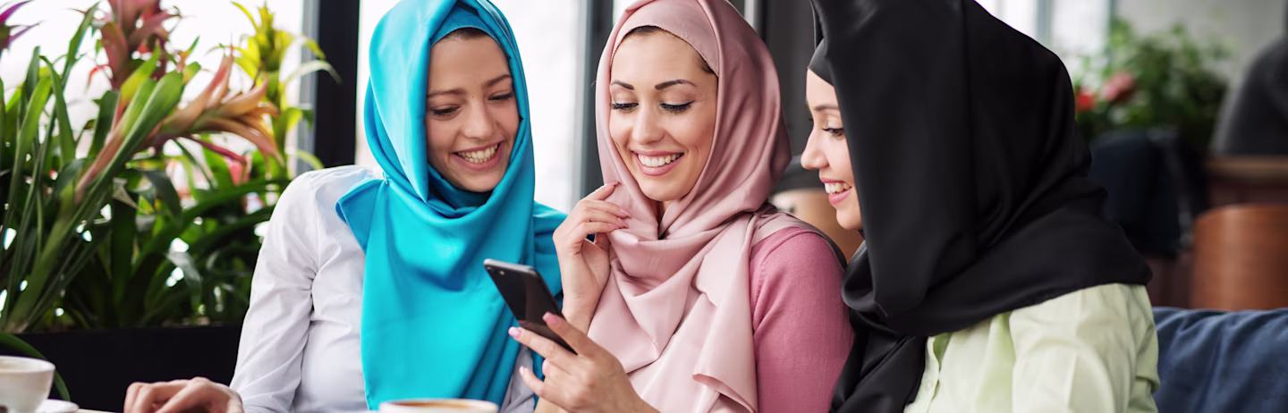 A group of IELTS test takers chat happily