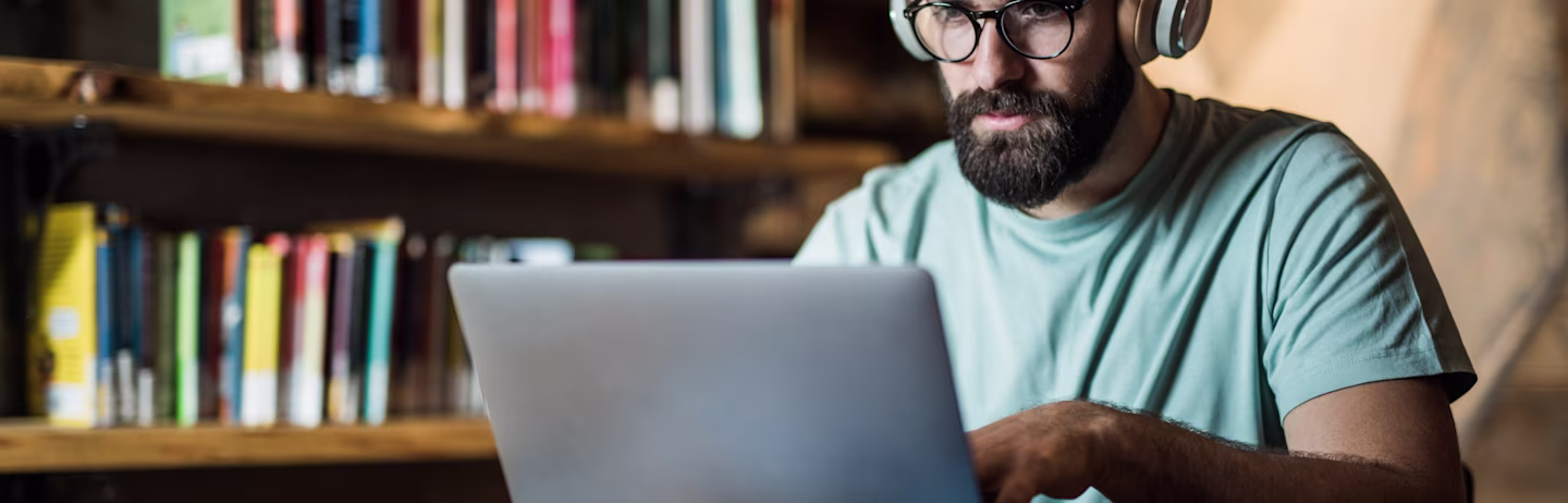 Male IELTS test taker prepares for IELTS Listening test