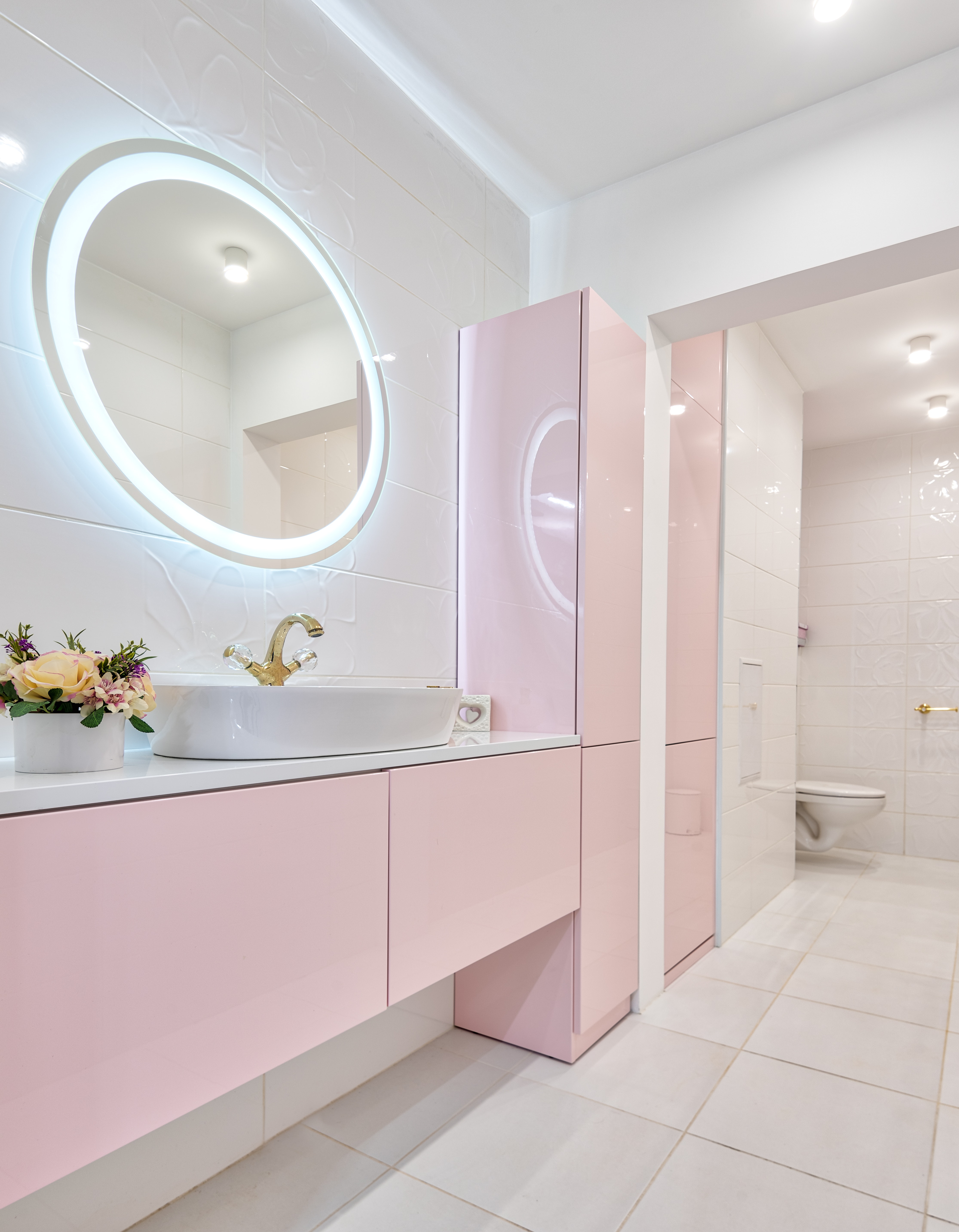 Pink bathroom cabinets. 