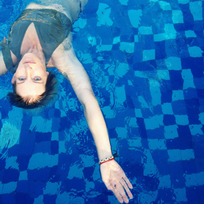 Woman in blue pool