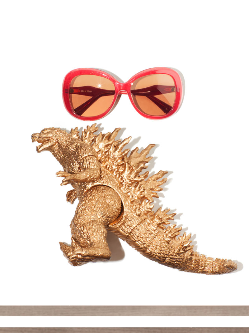 Women's red sunglasses and gold Godzilla