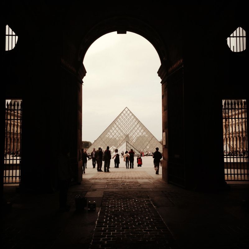 Looking through an arch at Louvre Museum, Paris