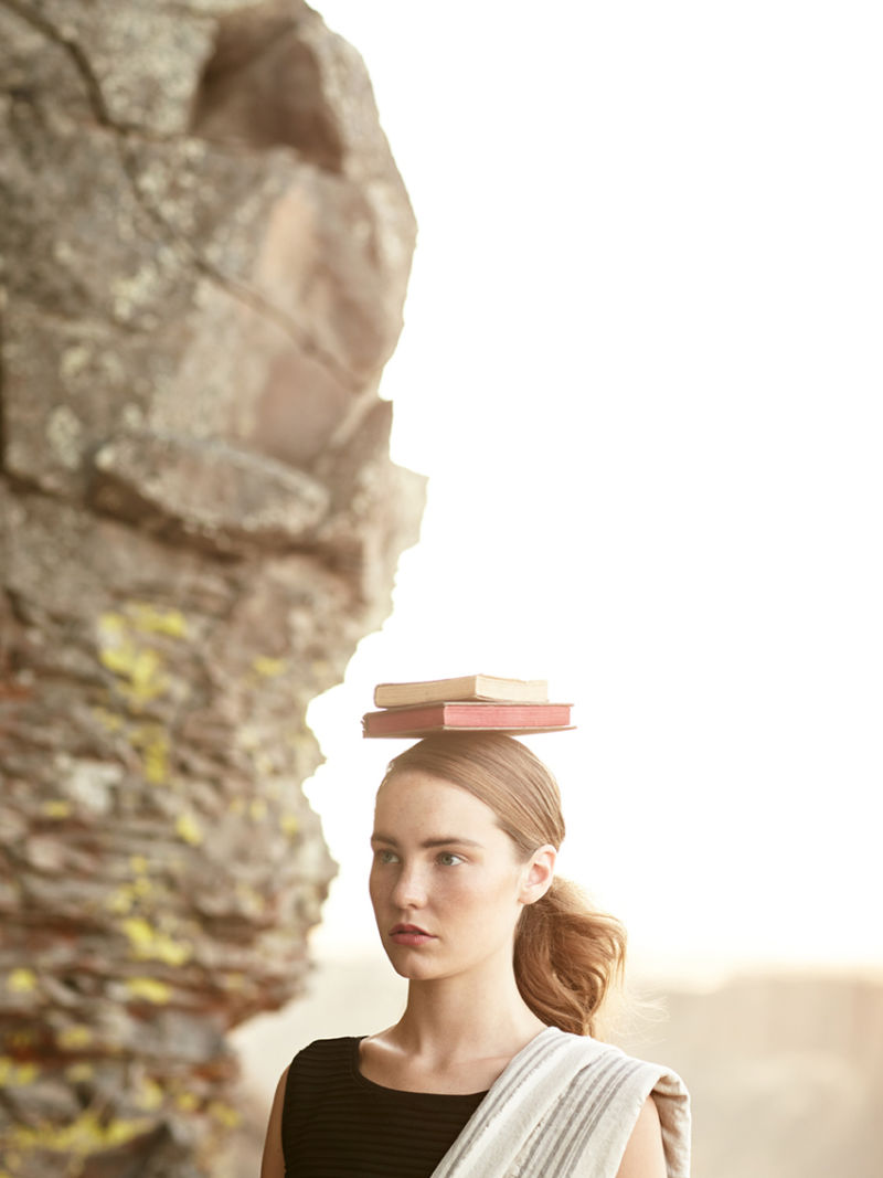 Woman with a book balanced on her head