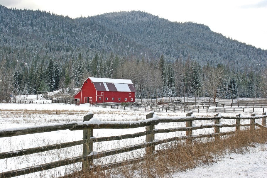 Red barn in snowy winter.