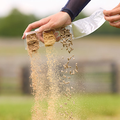 Hand pouring SmartPak supplements