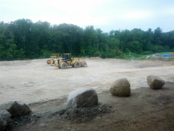 farm equipment working on layout of barn