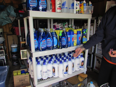 Overstock supplies organized in an area outside of the tack room.