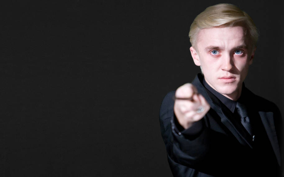Draco Malfoy pointing his wand