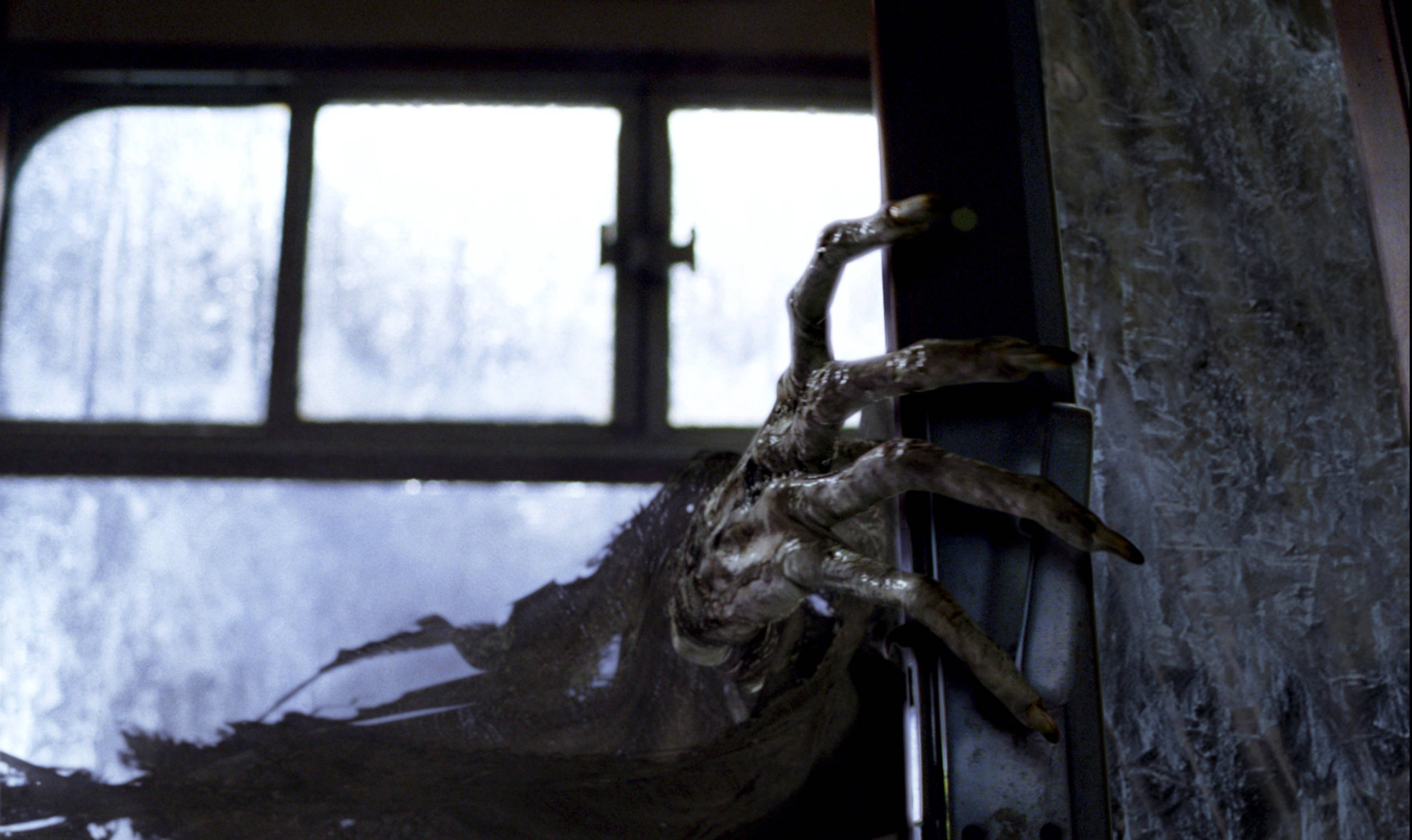 A Dementor's hand slowly opens the carriage door