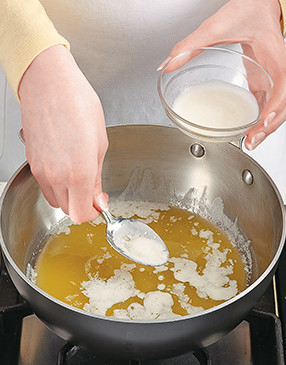 To prepare the butter, clarify it by first melting it. Then, skim off the foamy solids that rise to the top.