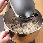 Mix dough until ingredients are moist, then knead and pat into a circle to finish combining dough.