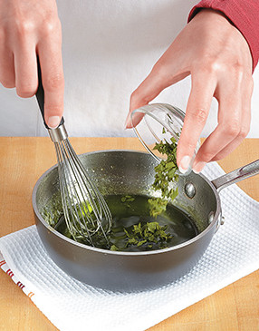 To preserve the color and flavor of the mint, let the glaze cool for a few minutes before adding it.