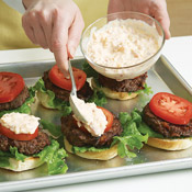 Dollop a spoonful of pimiento cheese on each tomato &mdash; it adds a little tanginess to the burger.
