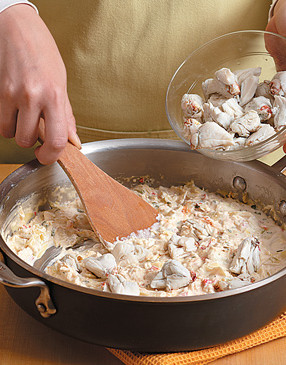 To keep the crabmeat in large chunks, gently stir the pieces into the pan off heat.
