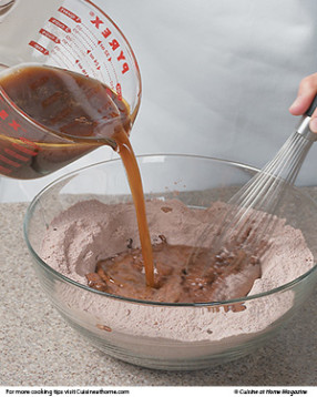 Combine wet ingredients with dry, whisking just to combine. Do not overmix or cake could be tough.