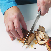 Allowing chicken to rest before slicing it across the grain yields pieces that are tender and juicy.