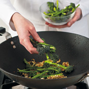 Add broccolini stalks and stir-fry until they begin to brown. You can use broccoli in place of the broccolini.