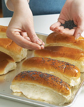 To make poppy seed buns, brush them with egg white, sprinkle with seeds, and bake at 400&deg; for 5 minutes.