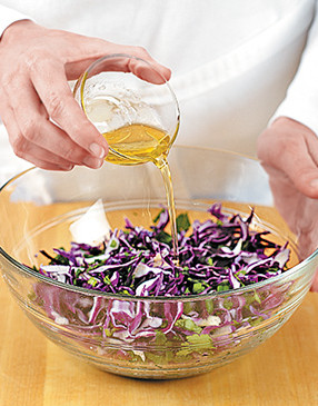 Combine the oil, vinegar, and salt for the slaw dressing and toss with the cabbage mixture until coated.