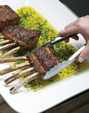 Turn grilled lamb in the oil to coat. Its residual heat will help release the flavors of the herbs and garlic.