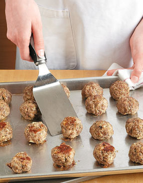 Flip the meatballs halfway through high-heat roasting to brown both sides.