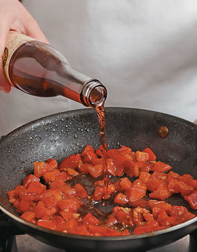 Add vinegar to tomatoes. The zing of the vinegar will complement the richness of the steak and cheese.