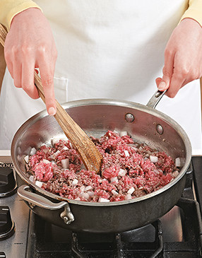 To speed up cooking time and to combine the flavors, cook the beef and onion together.