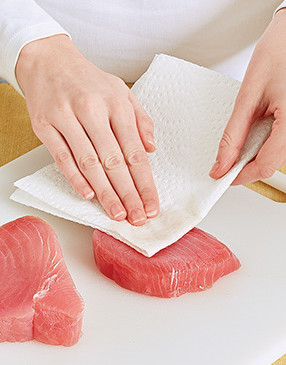 Pat the tuna steaks dry so they’ll get a good sear. Excess moisture can cause them to steam.