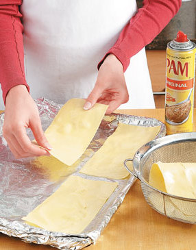 After blanching lasagna sheets, lay them flat on foil coated with non-stick spray to prevent sticking.