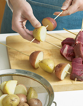 Because the steak and potatoes cook at different rates, don’t combine them on the same skewers.