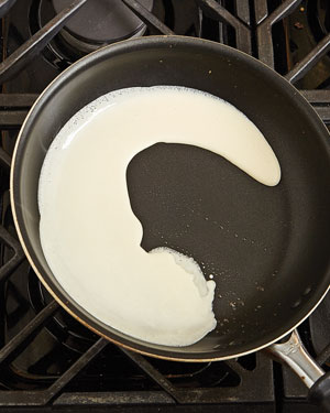 Immediately tilt the skillet and swirl the batter to spread it over the bottom of the skillet.