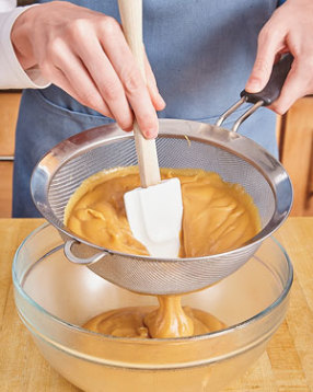 Strain the pastry cream through a sieve to remove any bits of eggs that may have curdled.
