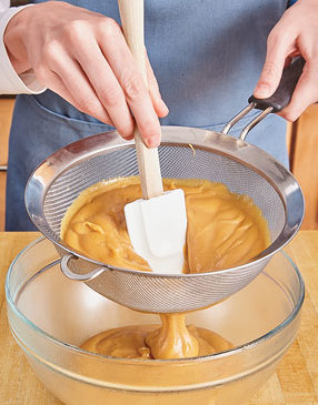 Strain the pastry cream through a sieve to remove any bits of eggs that may have curdled.