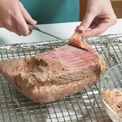 Use a knife to cut the layer of fat off the top of the beef. It will be easy to remove.