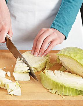 Chop the cabbage into bite-sized pieces. They cook faster than larger chunks, and they're easier to eat.