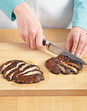 So the sandwich is easy to eat, slice the portobellos at an angle, creating larger pieces that'll lay flat.