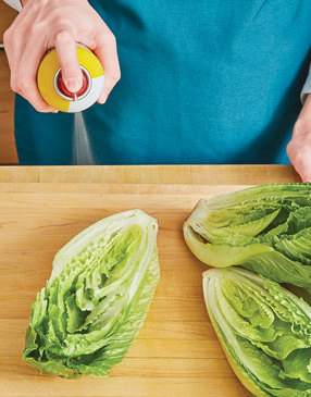 Coat the cut sides of the romaine to encourage quick charring which helps avoid soggy lettuce.