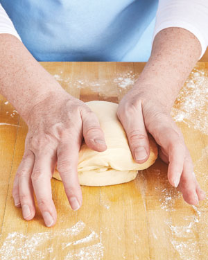 Kneading tangzhong on a surface 30–60 seconds