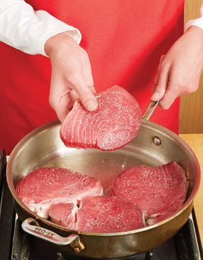 To get the best sear on the tuna, be sure the pan and oil are hot before adding the steaks.