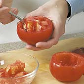 Hollow out tomatoes with a small spoon. Take care not to break through the skin.