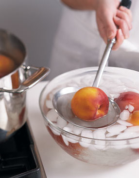 1) Boiling the peaches and then shocking them in ice water stops the cooking and makes it easier to remove their skins.