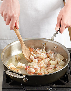 To avoid overcooking the lobster and shrimp, only partially cook them up front &mdash; they'll finish in the oven.