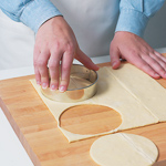 Use a biscuit cutter or a large lid from a jar to cut puff pastry into 4&ndash;41/2-inch circles.