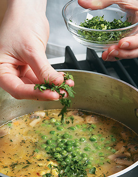 Stir in the peas and parsley just before serving. Otherwise, their color will fade.
